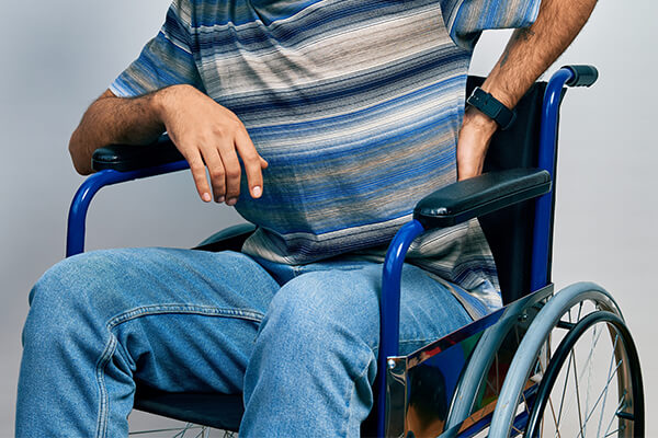 Discomfort and painful pressure sores caused by sitting in a wheelchair for long hours. 